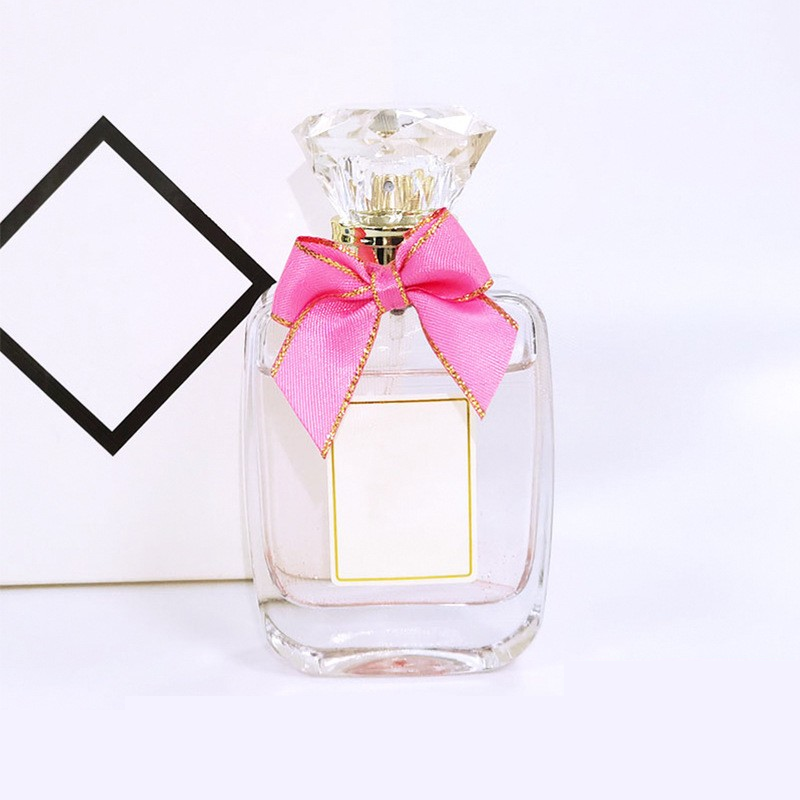 55ml customized wholesale gorgeous bow perfume glass packaging bottle transparent flat spray fragrance bottle
